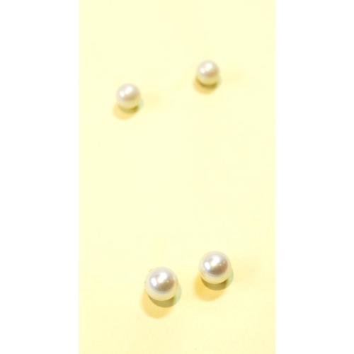 72 - Two pairs of cultured pearl ear studs.