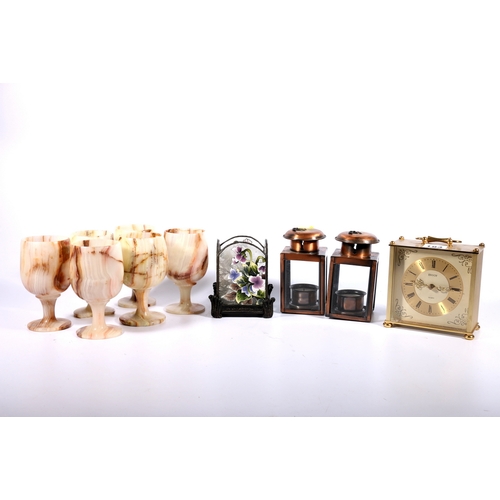 184 - Set of six onyx goblets, an Envoy quartz carriage style mantle clock and three candle holders.