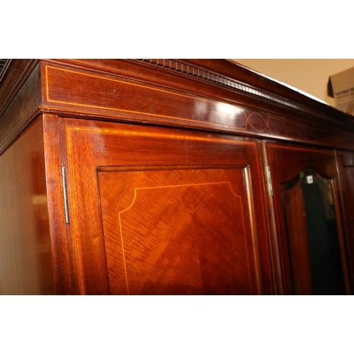 450 - Antique mahogany and inlaid triple door wardrobe with manufacturers plaque 'CWS Cabinet Maker Pelaw ... 