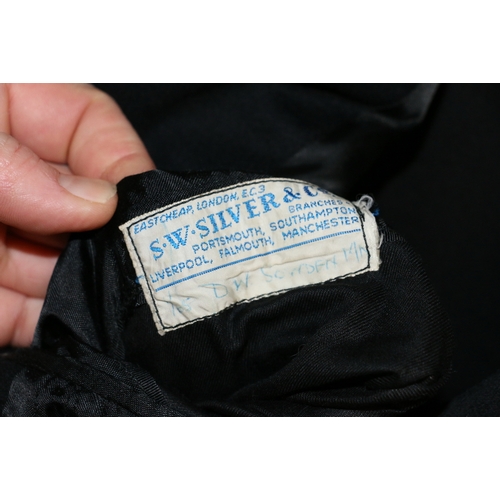 565 - British Royal Navy dress uniform jacket having S W Silver & Co label 