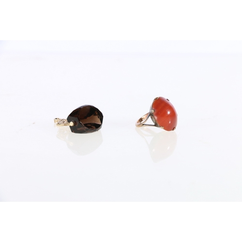 112 - 9ct gold cabochon oval carnelian dress ring, size I 4.6g gross and a 9ct gold mounted swivel fob wit... 