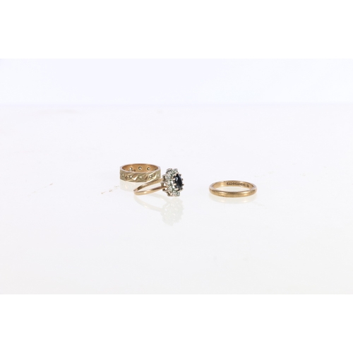 117 - 9ct yellow gold cluster ring size L 2.4g, 9ct gold eternity ring 2.6g and a 9ct gold wedding band 2.... 