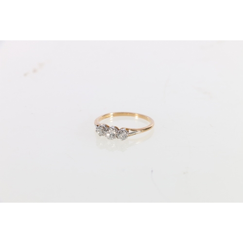 65 - 18ct gold and platinum diamond three stone ring, the central diamond approximately 0.25ct flanked by... 