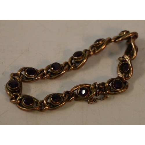 70 - 9ct gold bracelet set with twelve faceted amethysts, 12.8g gross, 9.5cm clasp closed.