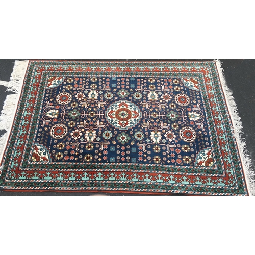 646 - Eastern blue ground fringed rug with Kishan Process Hamburg label, 210cm x 142cm