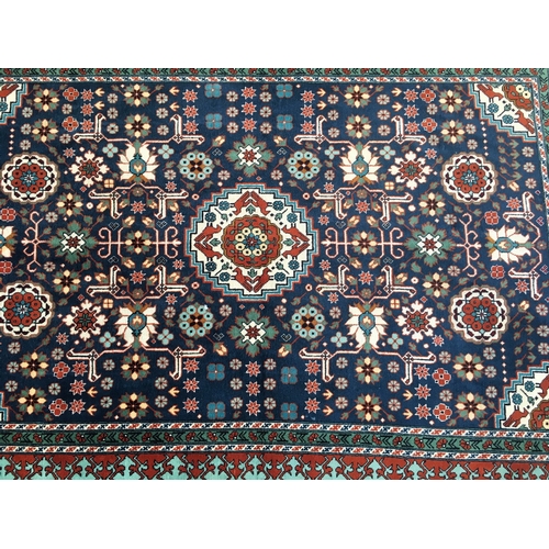 646 - Eastern blue ground fringed rug with Kishan Process Hamburg label, 210cm x 142cm