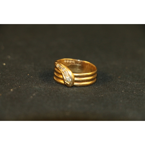 64 - 18ct gold snake ring set with five graduated diamonds, the largest approximately 0.1ct, hallmarks fo... 