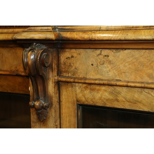 647 - Victorian Walnut breakfast library bookcase, the marble top raised on moulded plinth, over four glaz... 