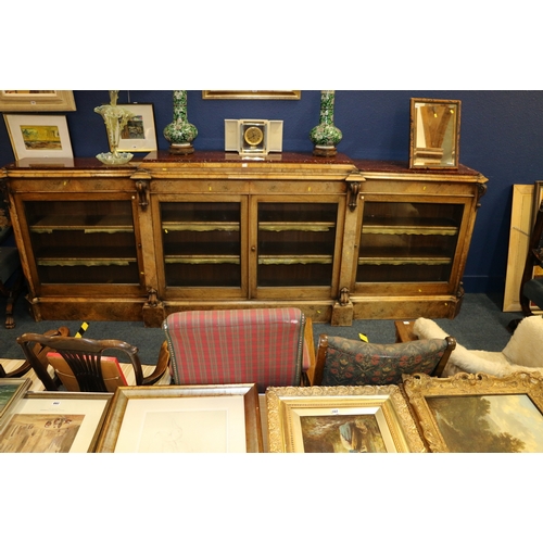 647 - Victorian Walnut breakfast library bookcase, the marble top raised on moulded plinth, over four glaz... 