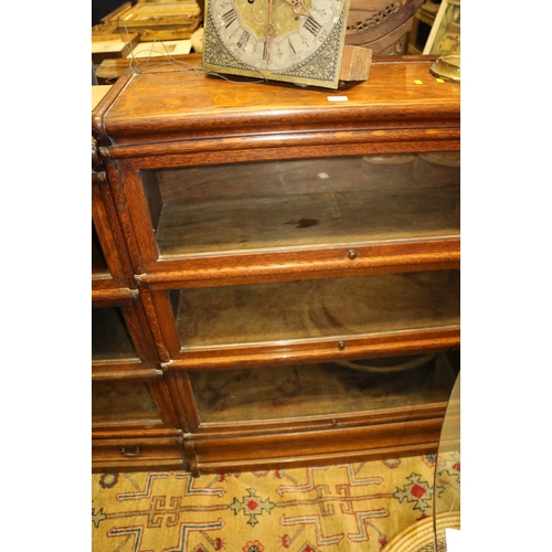 648 - Near pair of triple section Globe Wernicke oak stacking bookcases, 86 x 108 x 110cm.