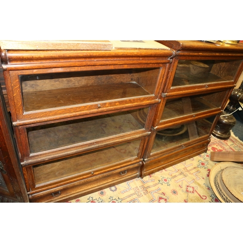 648 - Near pair of triple section Globe Wernicke oak stacking bookcases, 86 x 108 x 110cm.