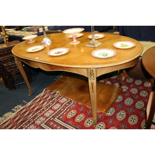 649 - Continental inlaid oval dining table with additional leaf, with gilt metal mounts, on scroll support... 