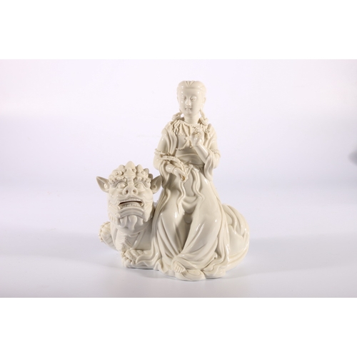 381 - Mid 20th century Chinese blanc de Chine figure of Quan Yin seated on a lion dog, 20cm x 18cm