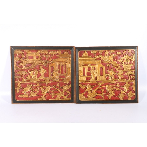 383 - Pair of early 20th century Chinese carved panels depicting figures in a pavilion landscape and garde... 