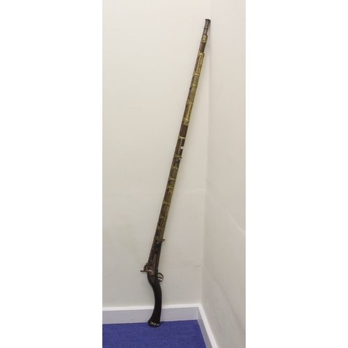 126 - Antique Turkish Jezail camel gun measuring 166cm in length. The barrel being brass bound is engraved... 