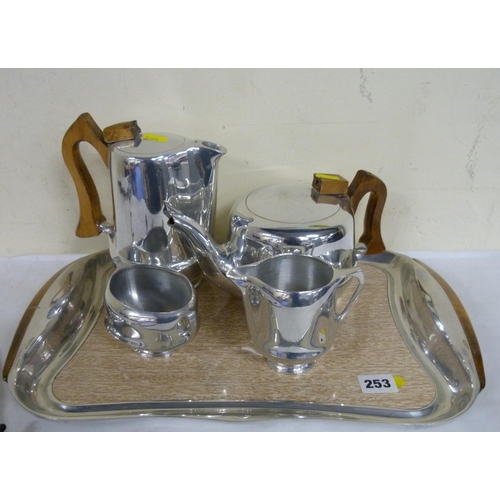 253 - Piquot ware tea set and a tray