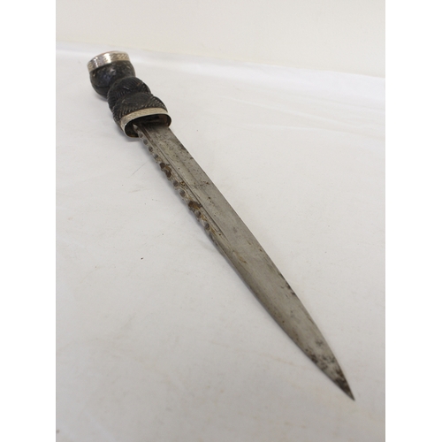 104 - Scottish piper's dirk with accompanying knife and fork. Carved ebony handles and citrine paste finia... 