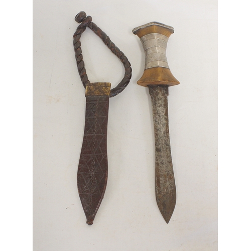 115 - Two antique Sudanese arm knives both of leaf form and with original leather scabbards. The smallest ... 