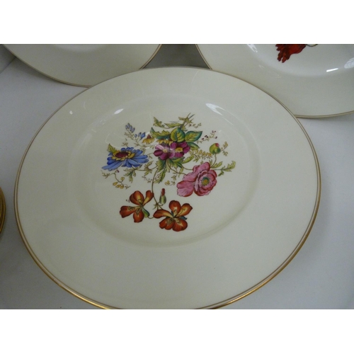 36 - Wedgwood floral decorated part dinner service comprising eight side plates, eight fish plates and ei... 