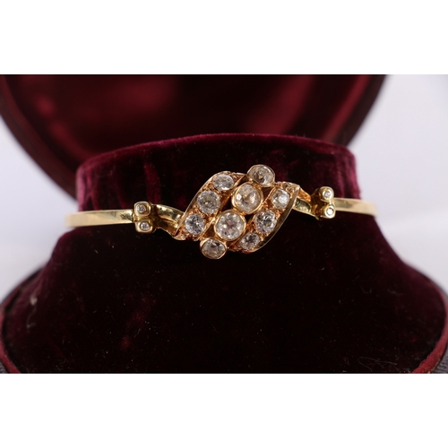 89 - Unhallmarked yellow metal diamond bracelet, the largest pair of stones each approximately 0.6cts fla... 