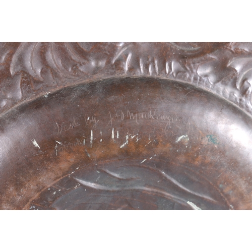 233 - An Arts & Crafts Newlyn School repousse copper charger decorated to the centre with galleon sail... 