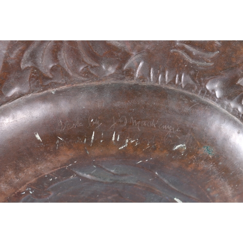 233 - An Arts & Crafts Newlyn School repousse copper charger decorated to the centre with galleon sail... 