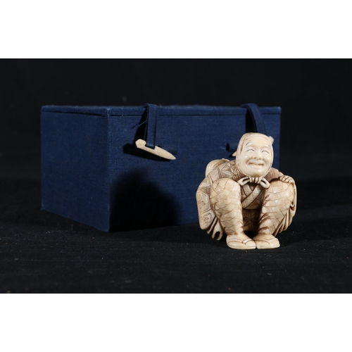 351 - Well carved Ivory netsuke or okimono of a seated Yakuharai or Demon (oni) hunter, with a large sack ... 