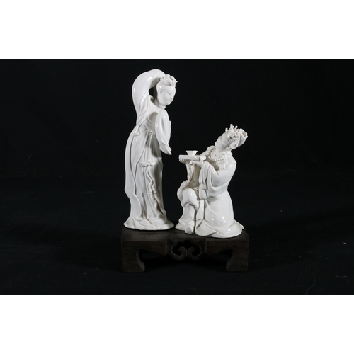 381 - Mid 20th century Chinese blanc de Chine figure of Quan Yin seated on a lion dog, 20cm x 18cm