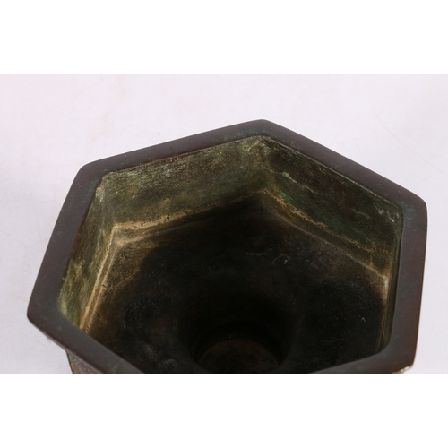 410 - 19th Chinese bronze incense burner dish of hexagonal shape, the sides decorated with dragons on a di... 