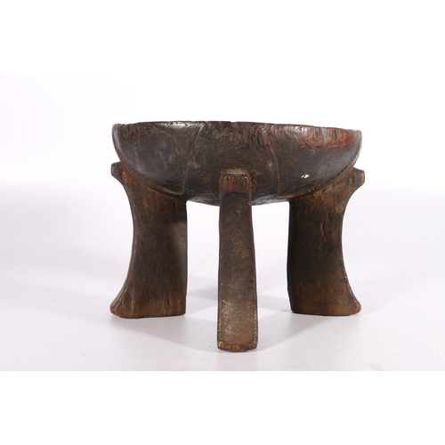 421 - Ethiopian ironwood Jima stool with dished top, on four carved supports, possibly early 20th Century,... 