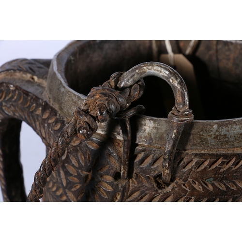 424 - Nepalese carved wooden pail with metal band to the rim, base and handles and twisted carrying ropes,... 