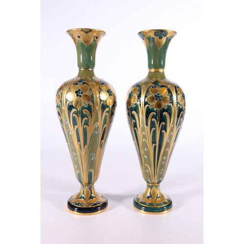 261 - Pair of MacIntyre Moorcroft Burslem Florian ware vases with pipelined decoration of gilded flowers a... 