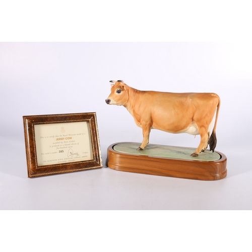 267 - Royal Worcester porcelain model of a Jersey Cow modelled by Doris Lindner on wooden plinth base with... 