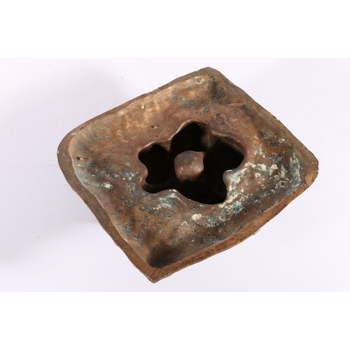 299 - An unusual bronze casting of five lumps of camel dung, 19cm x 17cm