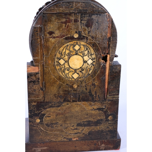 304 - An unusual carved mahogany death clock, the brass dial with gravestone supported by eagle, skull and... 