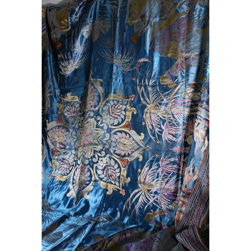 325 - A fine needlework silk throw decorated with Arabian desert scene, palm trees, camels, temples etc., ... 