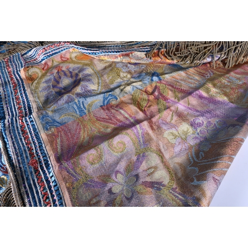 325 - A fine needlework silk throw decorated with Arabian desert scene, palm trees, camels, temples etc., ... 