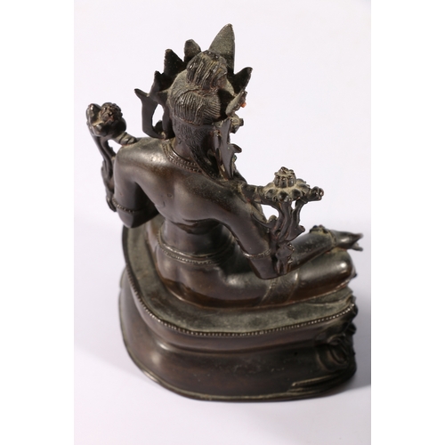 345 - A 19th century Indian bronze Tara seated on a double lotus throne, with inset glass 'jewels', carved... 