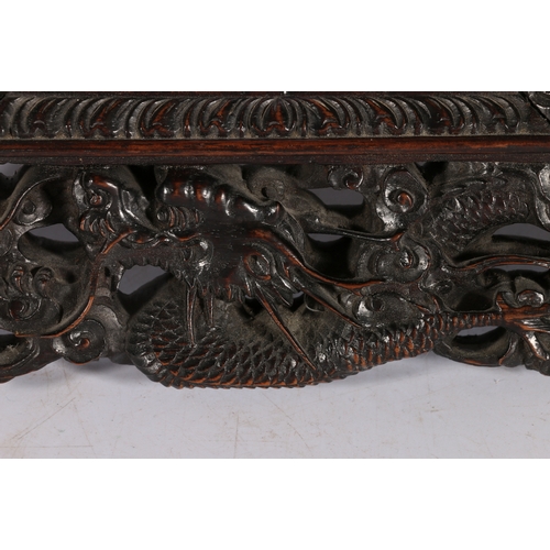 371 - Chinese late 19th century carved and pierced mirror frame, the frame depicting dragons amongst waves... 