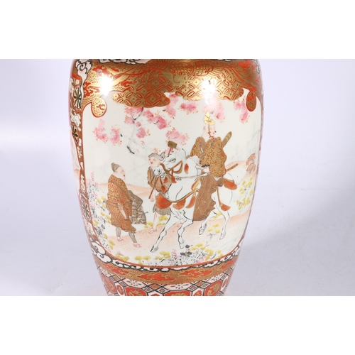 382 - A large Japanese Kutani high shouldered vase decorated with two panels depicting a rider and attenda... 