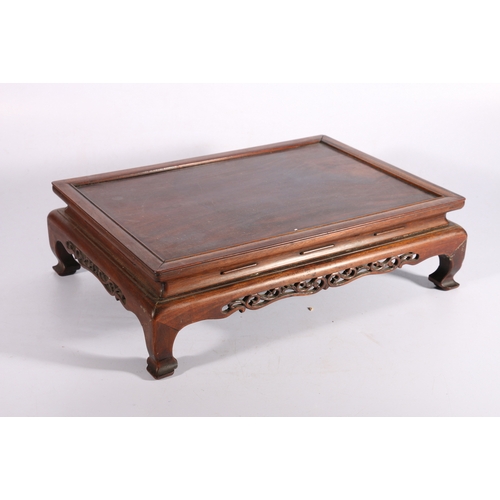 399 - Large 19th century Chinese hardwood stand, the rectangular top with shaped and pierced carved apron,... 