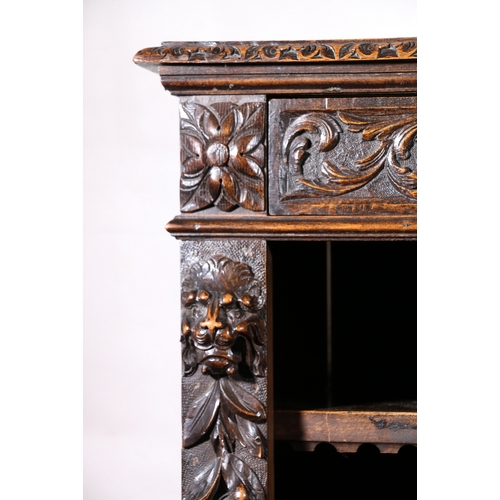 441 - Antique heavily carved oak break front bookcase, frieze fitted with three drawers above carved lion ... 