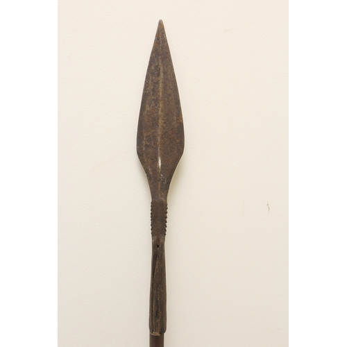 156 - Antique African Assegai style throwing spear with barbed leaf spearhead. 135cm long.