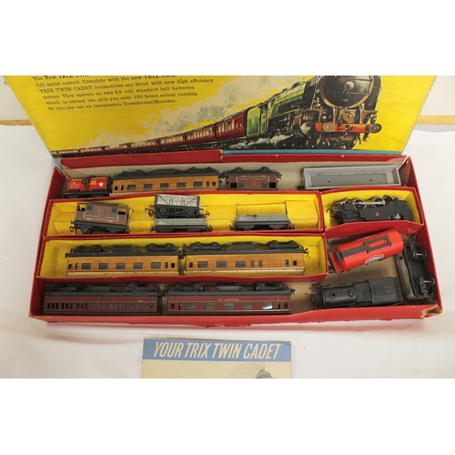 343 - Box of engines & rolling stock in a Trix Twin Cadet Railway box. Some original Trix components b... 