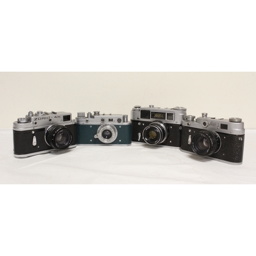 376 - Four vintage Russian film cameras to include Zorki 4K with a Helios Jupiter 50mm F2 lens and a Fed 3... 