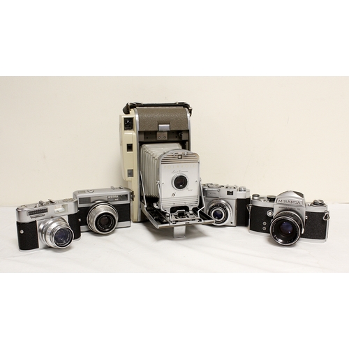 378 - Five vintage cameras to include a 1950's Polaroid 800 land camera, Japanese Miranda SRL with a 50mm ... 