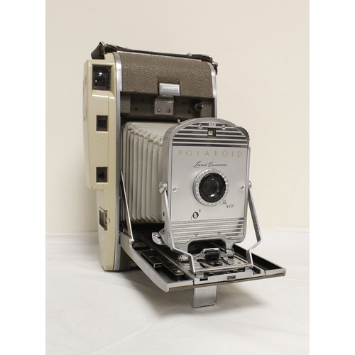 378 - Five vintage cameras to include a 1950's Polaroid 800 land camera, Japanese Miranda SRL with a 50mm ... 