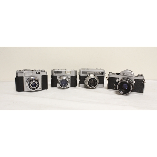 378 - Five vintage cameras to include a 1950's Polaroid 800 land camera, Japanese Miranda SRL with a 50mm ... 