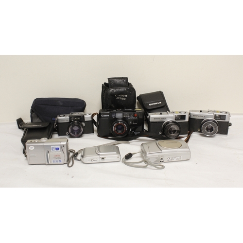 379 - Selection of vintage film and digital cameras to include two digital Olympus cameras, two Olympus Tr... 