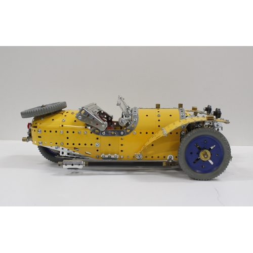 299 - Large Meccano constructed model of a three-wheeled sports car in yellow and silver, 47cm long